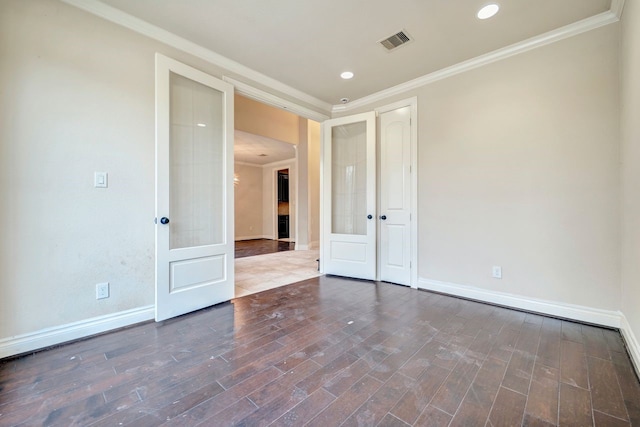 unfurnished room featuring crown molding