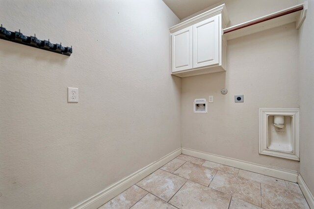 laundry area with washer hookup, cabinets, light tile patterned floors, and hookup for an electric dryer