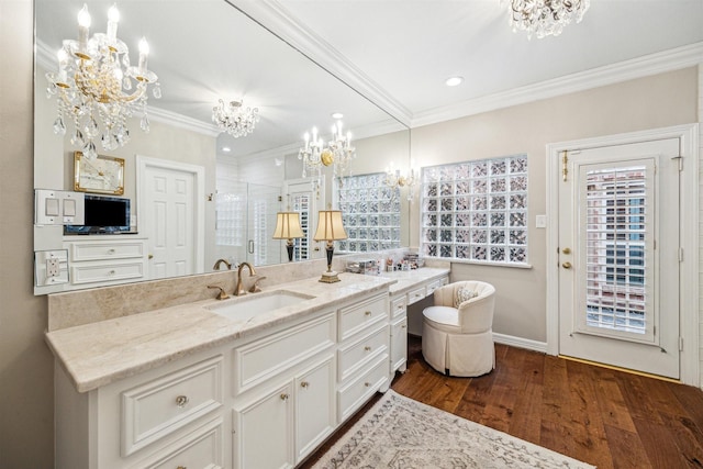 bathroom with crown molding, hardwood / wood-style flooring, an enclosed shower, a notable chandelier, and vanity