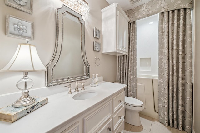 full bathroom featuring vanity, toilet, tile patterned flooring, and shower / tub combo