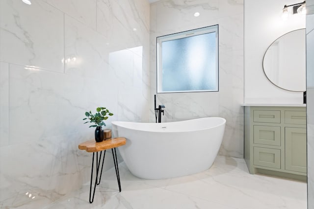 bathroom featuring vanity and a washtub