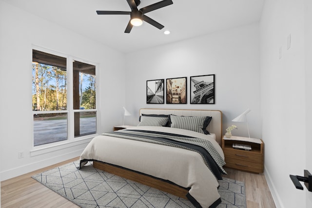 bedroom featuring light hardwood / wood-style flooring and ceiling fan