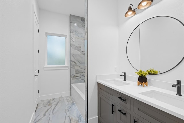 bathroom featuring vanity and tiled shower / bath combo