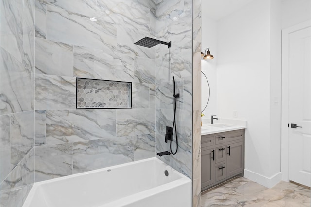 bathroom featuring tiled shower / bath combo and vanity