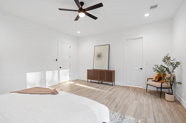 bedroom with light wood-type flooring and ceiling fan