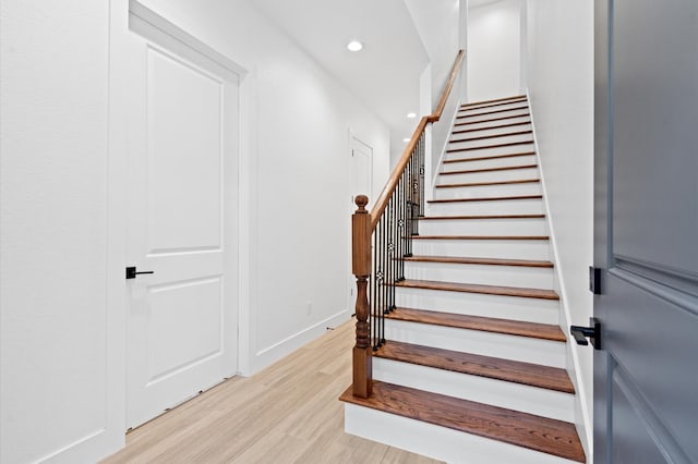 staircase featuring wood-type flooring