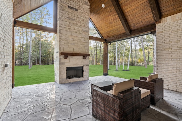 view of patio with an outdoor stone fireplace