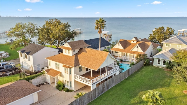 birds eye view of property with a water view