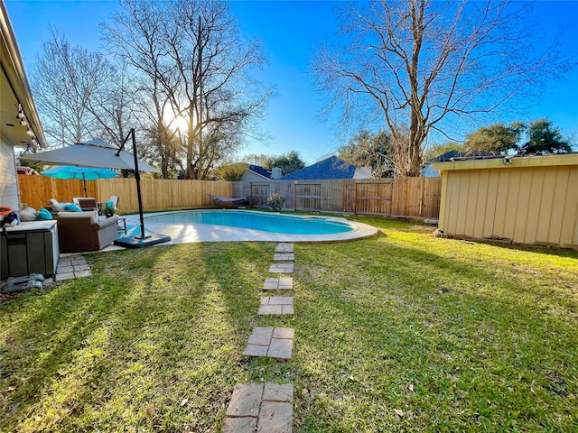 view of yard with a fenced in pool and an outdoor hangout area