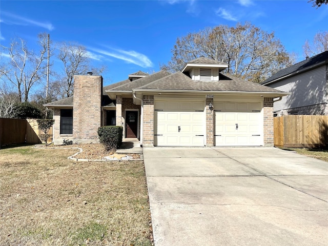 view of front facade with a garage and a front yard