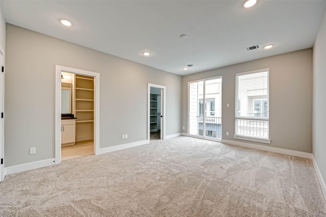 interior space featuring light colored carpet