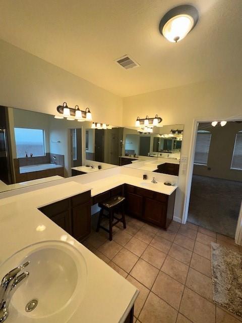 bathroom with vanity and tile patterned flooring