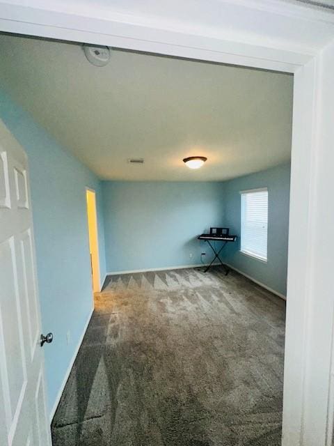 spare room featuring carpet flooring