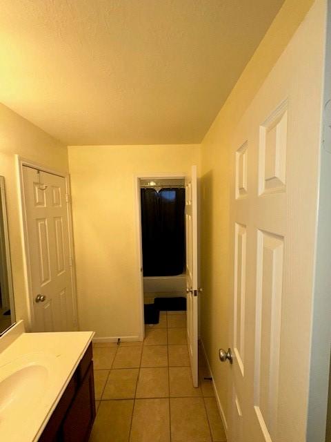 bathroom with tile patterned floors and vanity