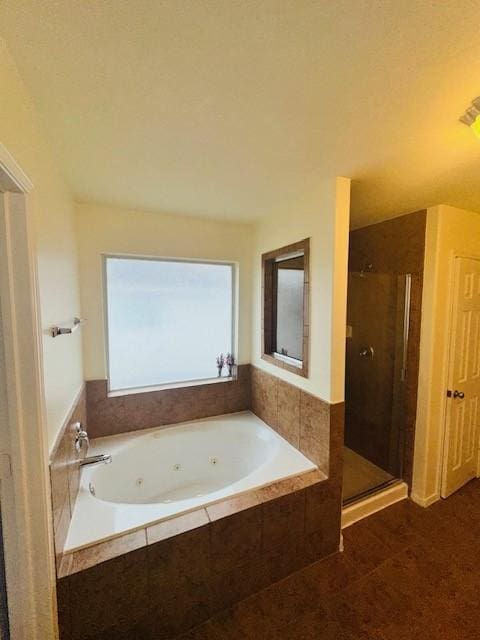 bathroom with tile patterned floors and plus walk in shower