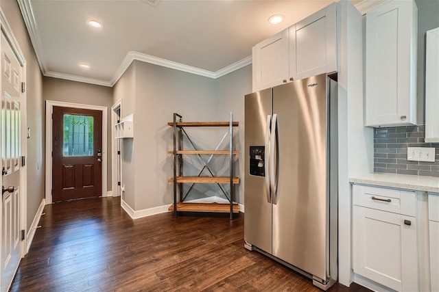 kitchen featuring stainless steel refrigerator with ice dispenser, tasteful backsplash, light stone counters, white cabinets, and dark hardwood / wood-style flooring