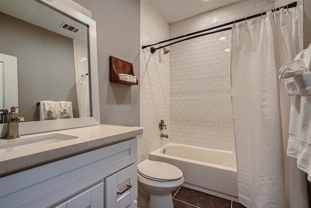 full bathroom featuring shower / bath combination with curtain, vanity, toilet, and tile patterned flooring