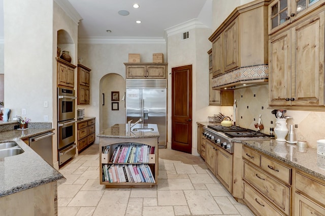 kitchen featuring sink, tasteful backsplash, crown molding, stainless steel appliances, and light stone countertops