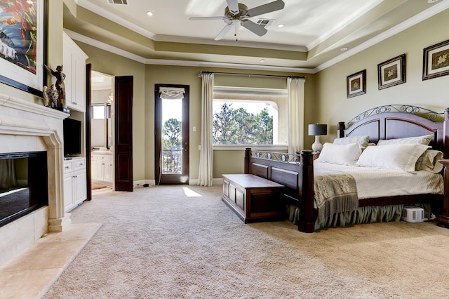 bedroom featuring a raised ceiling, ornamental molding, access to outside, and light colored carpet