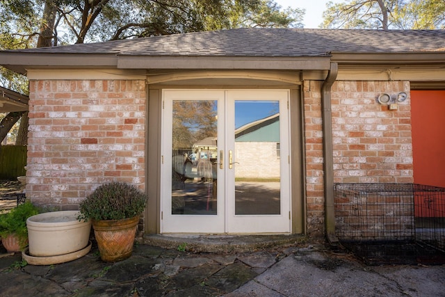 view of exterior entry featuring french doors