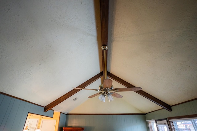 room details featuring beam ceiling and ceiling fan