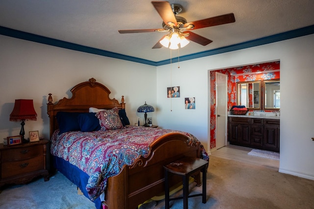 bedroom featuring light carpet, crown molding, ensuite bath, and a textured ceiling