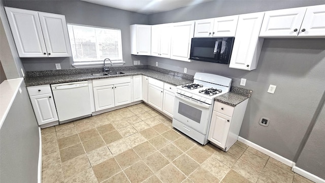 kitchen with white cabinetry, sink, and white appliances