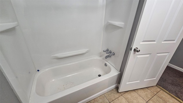 bathroom featuring tile patterned flooring and bathing tub / shower combination