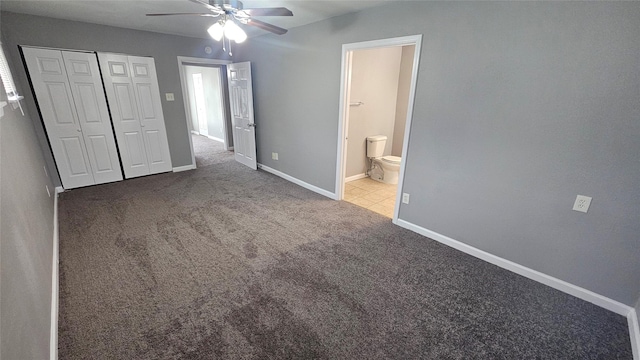 unfurnished bedroom featuring ceiling fan, ensuite bath, a closet, and light carpet