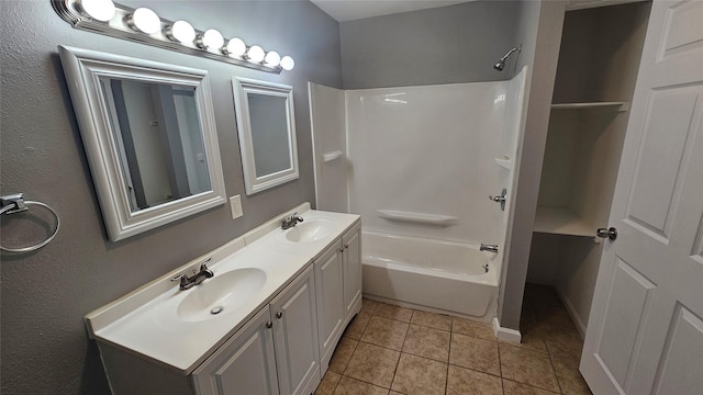 bathroom featuring vanity, bathtub / shower combination, and tile patterned flooring