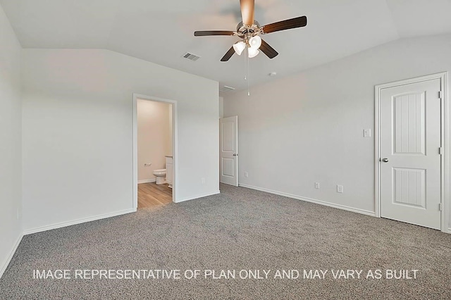 unfurnished bedroom with lofted ceiling, ensuite bath, ceiling fan, and carpet flooring