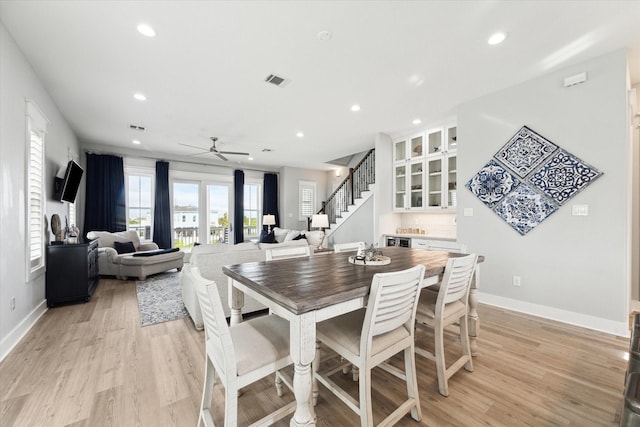 dining area featuring ceiling fan and light hardwood / wood-style floors