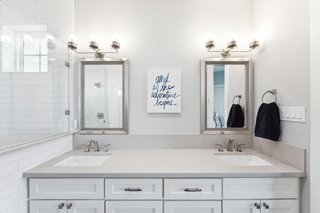 bathroom featuring vanity and tiled shower