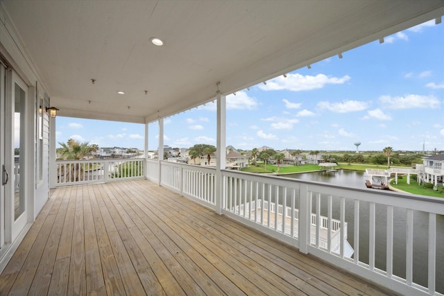 wooden terrace with a water view