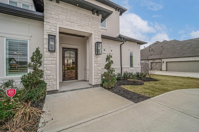 view of exterior entry with a garage