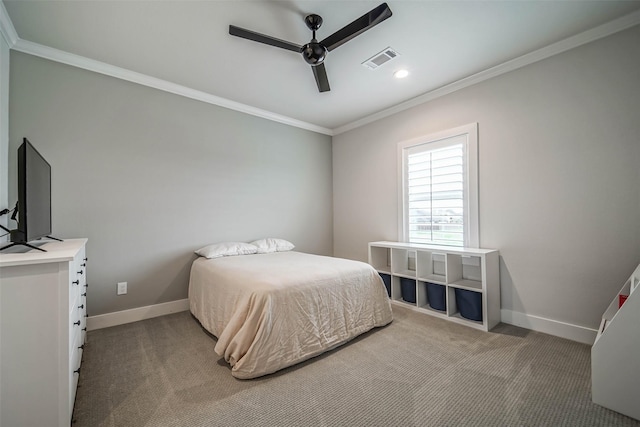 bedroom with ceiling fan, ornamental molding, and carpet