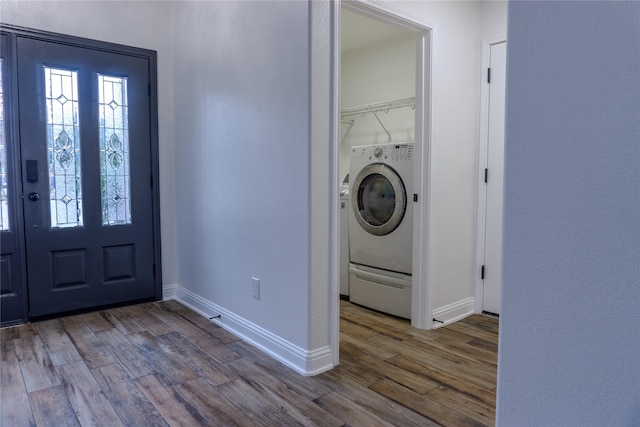 washroom featuring wood-type flooring and washer / dryer