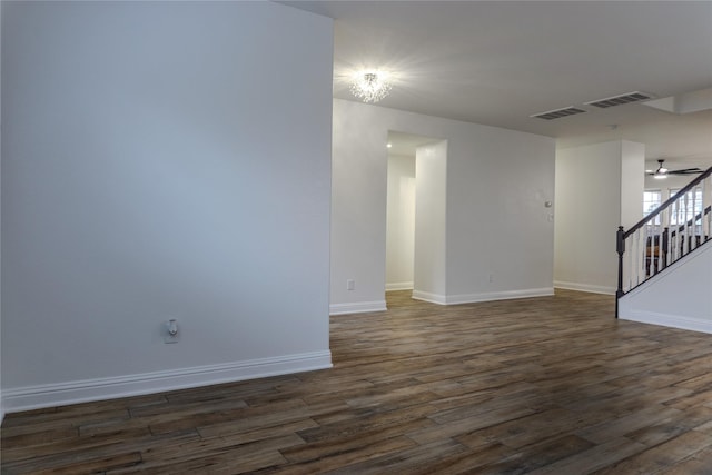 empty room featuring dark hardwood / wood-style floors and ceiling fan