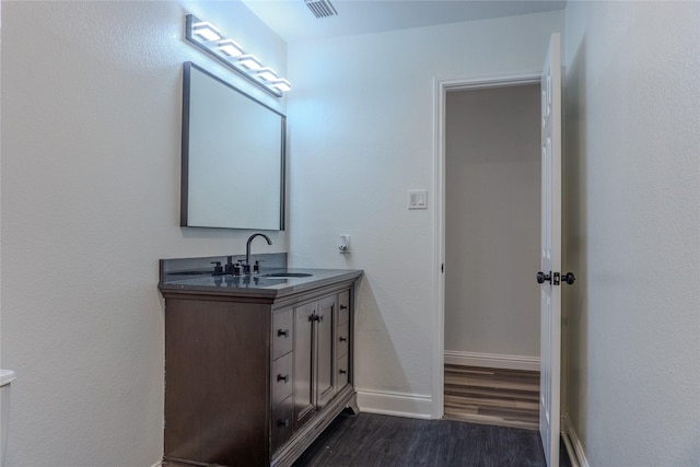 bathroom featuring vanity and hardwood / wood-style floors