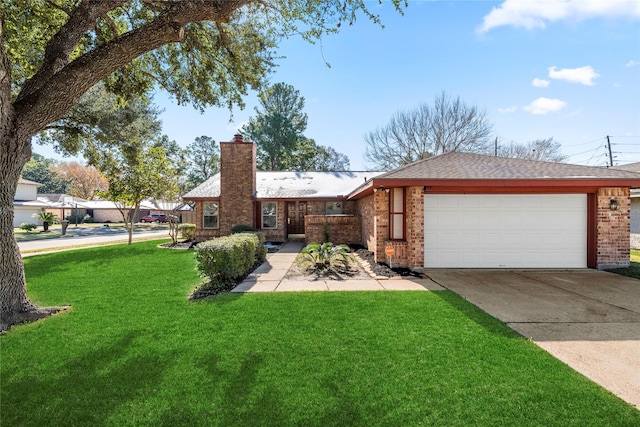 view of front of house with a garage and a front yard