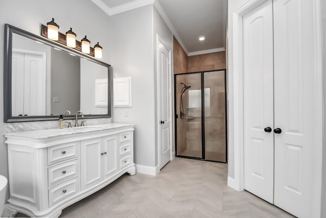 bathroom with vanity, ornamental molding, and a shower with door