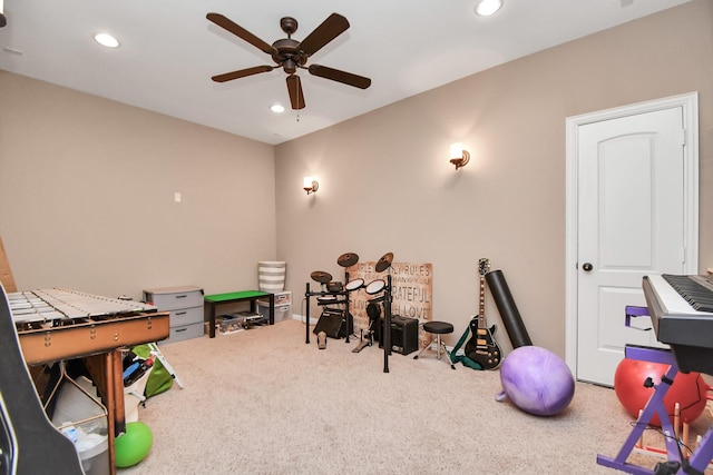 recreation room with ceiling fan and carpet floors