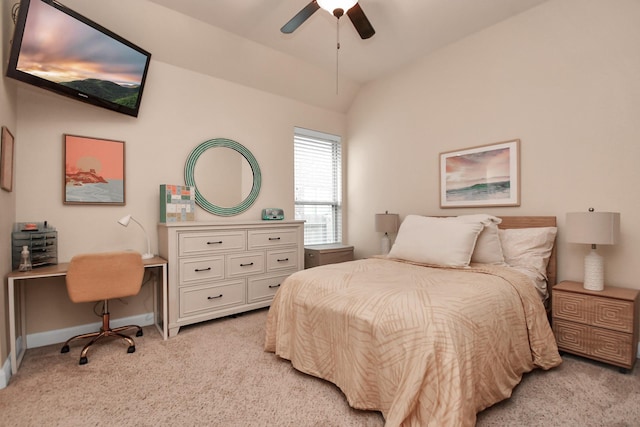 bedroom featuring vaulted ceiling, light colored carpet, and ceiling fan