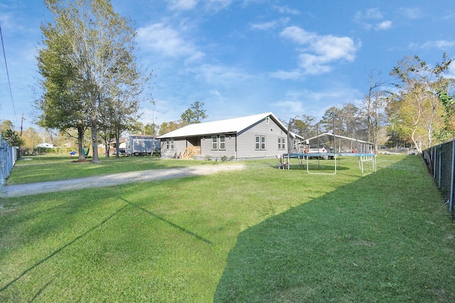 view of yard with a trampoline