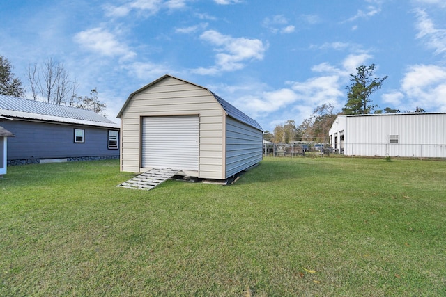 view of outdoor structure featuring a yard