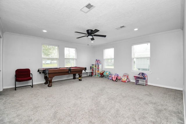 rec room with crown molding, billiards, ceiling fan, a textured ceiling, and light carpet