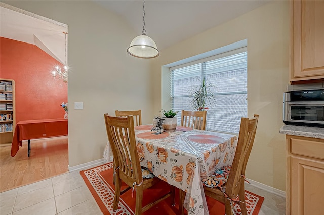 dining area with light tile patterned floors