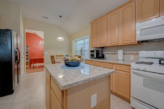 kitchen featuring pendant lighting, white appliances, a center island, light brown cabinetry, and vaulted ceiling