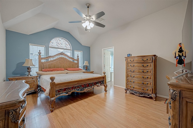 bedroom with lofted ceiling, ceiling fan, and light hardwood / wood-style flooring