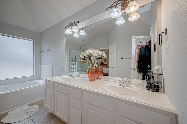 bathroom featuring vanity, plus walk in shower, tile patterned flooring, and vaulted ceiling